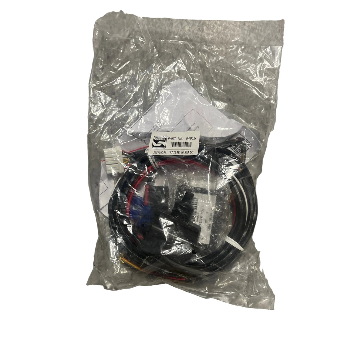 A packaged black cable assembly with multiple connectors, sealed in a clear plastic bag, placed on a gray speckled floor. Hayman Reese Trailer Harnes universal 